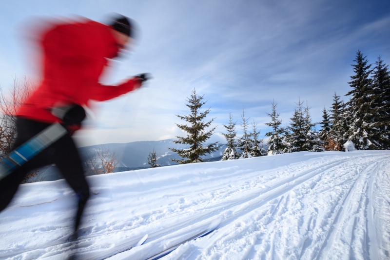 2773605-cross-country-skiing-young-man-cross-country-skiing-on-a-lovely-sunny-winter-day-motion-blur-technique-is-used-to-convey-movement